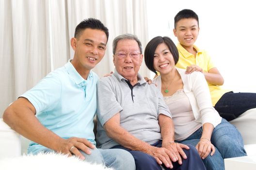 Indoor portrait of beautiful asian 3 generations family