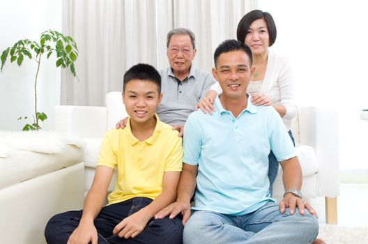 Indoor portrait of beautiful asian 3 generations family