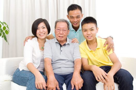 Indoor portrait of beautiful asian 3 generations family