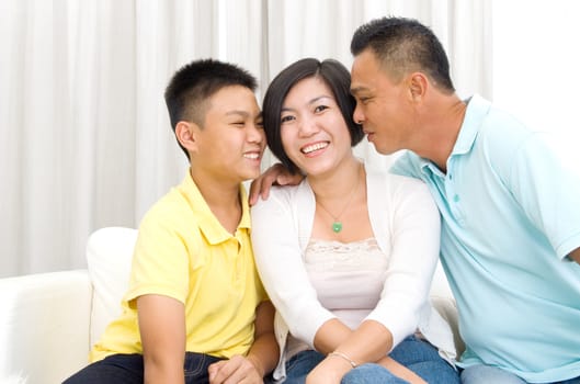 Indoor portrait of beautiful asian family