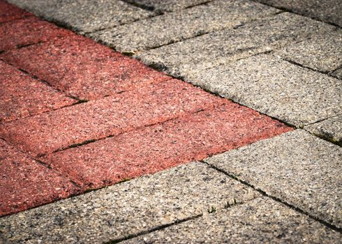 detail of old concrete pavement red and gray