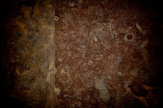 Vignetted stone wall background with lots of texture