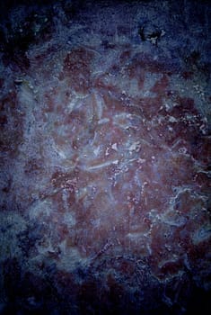 Vignetted stone wall background with lots of texture