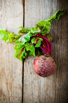 Fresh organic beet on a wood table. 