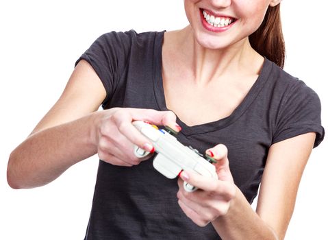 Young woman plays a videogame, isolated on white background