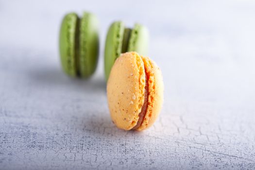 Almond cookies French macaroons on a white surface