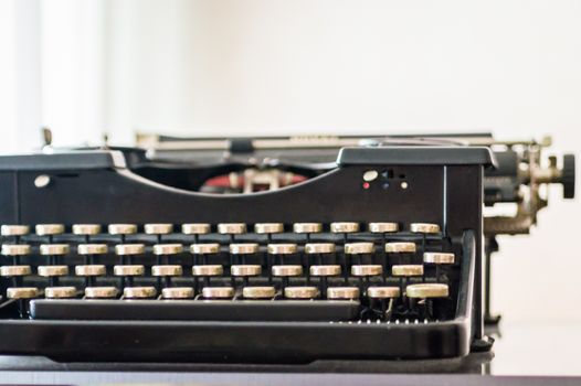 Close up french old typewriter on a white background