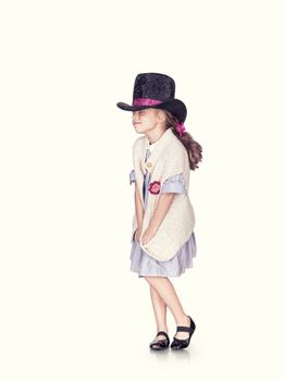 portrait of nice young girl posing in hat on white back