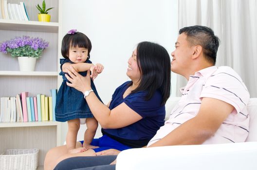 Asian family having fun at home