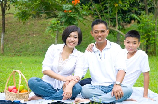 Asian Chinese Family Relaxing at outdoor park 