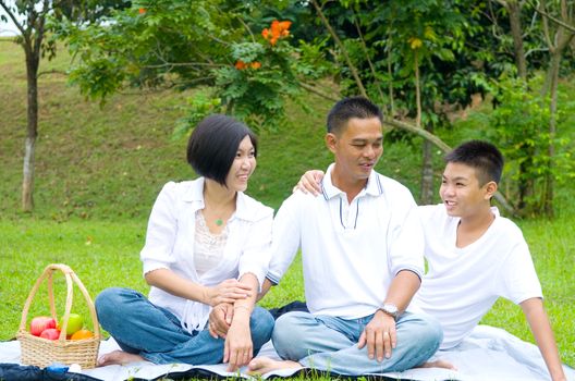 Asian Chinese Family Relaxing at outdoor park 