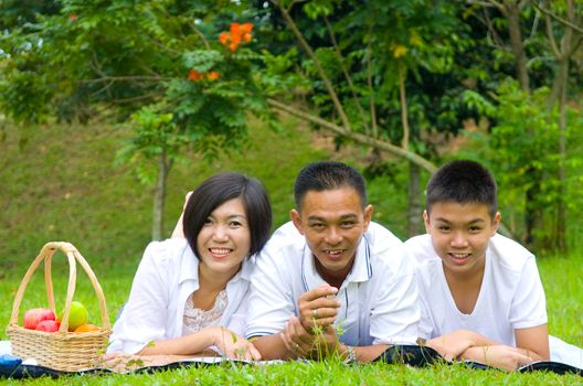 Asian Chinese Family Relaxing at outdoor park 