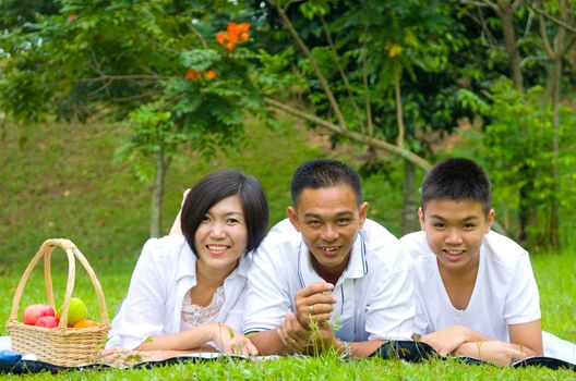 Asian Chinese Family Relaxing at outdoor park 