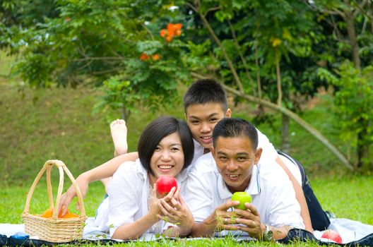 Asian Chinese Family Relaxing at outdoor park 