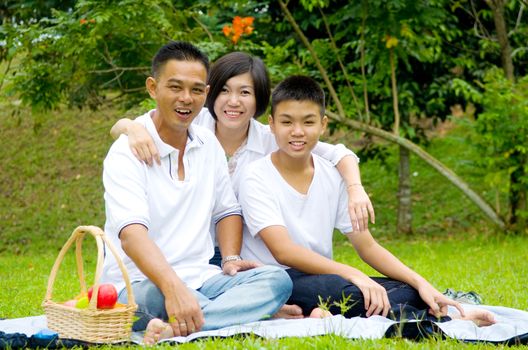 Asian Chinese Family Relaxing at outdoor park 