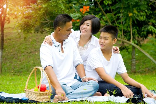 Asian Chinese Family Relaxing at outdoor park 