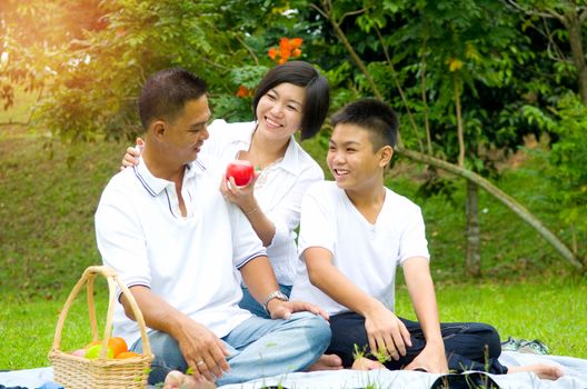 Asian Chinese Family Relaxing at outdoor park 