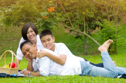 Asian Chinese Family Relaxing at outdoor park 