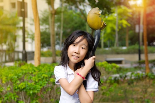 Outdoor portrait of little asian girl