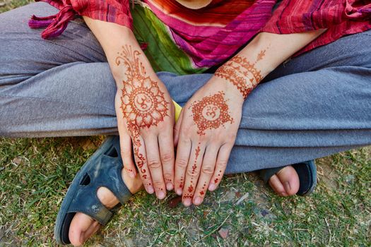 Mehndi on womans arms