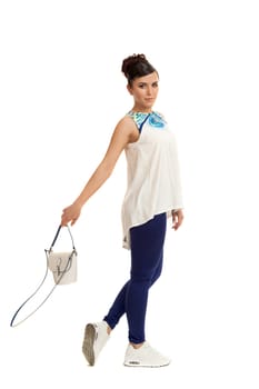 the young woman in convenient clothes with a bag on a white background