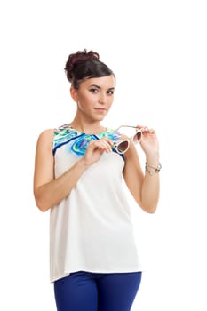 the young woman in sunglasses and in convenient clothes on a white background