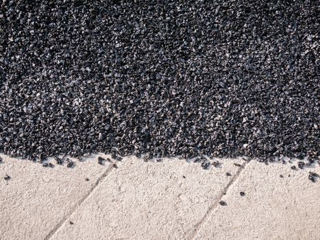Close up asphalt road repair. Repair pavement and laying new asphalt patching method outdoors.