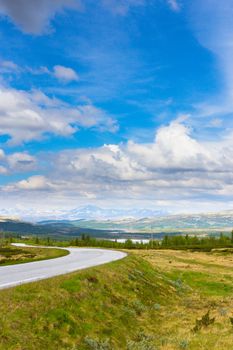 Road in Norway. Summer landscape with blue sky and mountains
