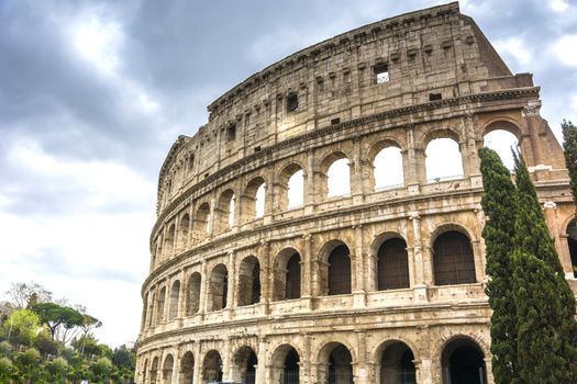 view on the Great Roman Colosseum Coliseum, Colosseo ,also known as the Flavian Amphitheatre. Famous world landmark. Scenic urban landscape. Rome. Italy. Europe