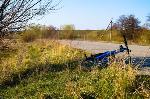 a Bicycle left on the side of the road