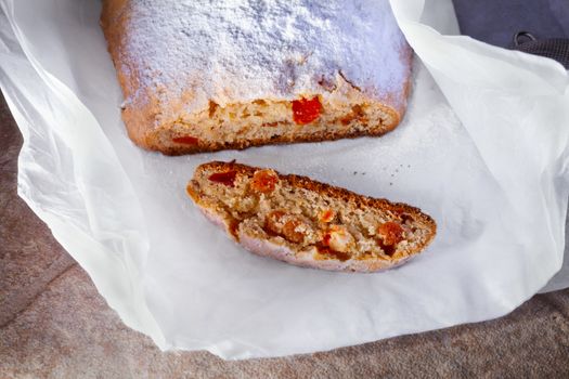 Traditional Christmas Stollen on a stone surface