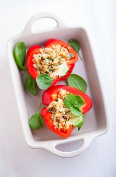 Stuffed red peppers filled with quinoa and vegetables