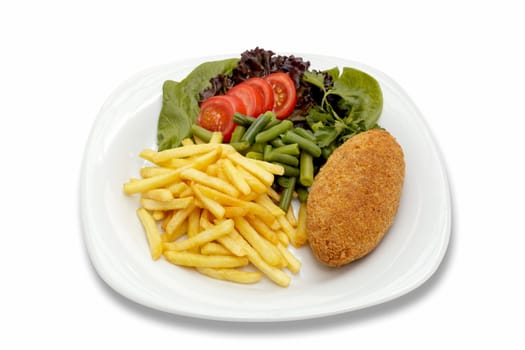 Chicken cutlet with French fries and vegetables. Shooting from the top on a sheet of white plastic.