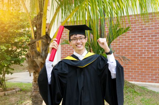 Cheerful asian university graduate