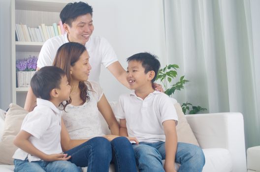 Indoor portrait of asian mixed race family