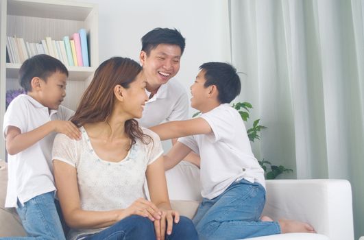 Asian family having fun at home