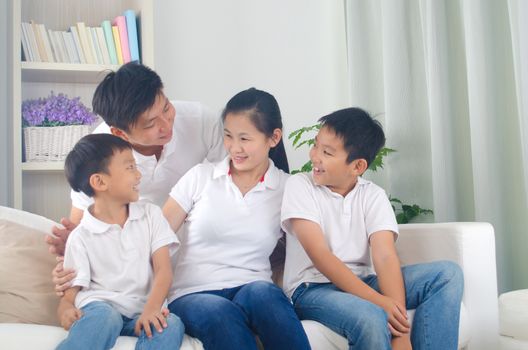 Indoor portrait of asian mixed race family