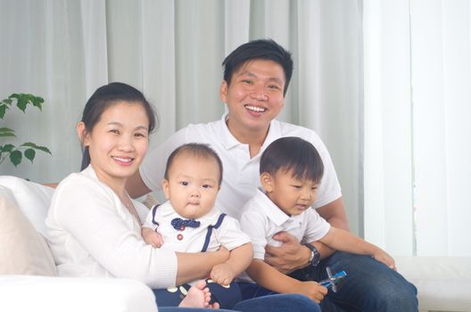 Indoor portrait of asian family