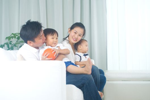 Indoor portrait of asian family