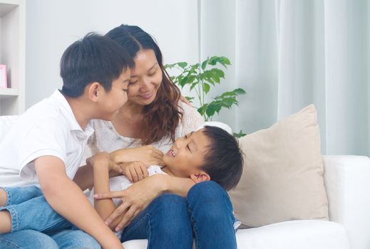 Asian family having fun at home