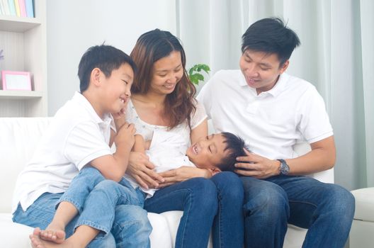 Asian family having fun at home