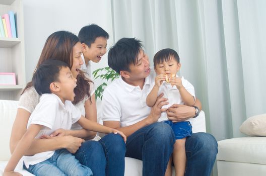 Indoor portrait of asian family