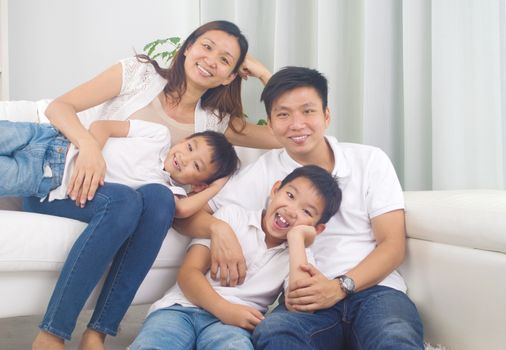 Asian family having fun at home