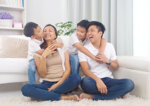 Asian family having fun at home