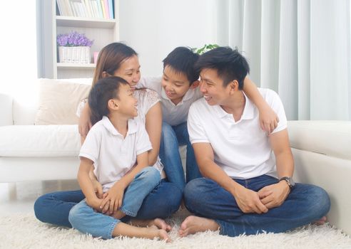 Indoor portrait of asian family