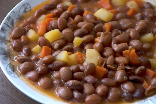 Turkish food: Carrot and potatoes cooked with kidneys meal: Barbunya Pilaki  close- horizontal top view