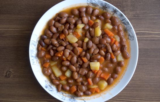 Turkish food: Carrot and potatoes cooked with kidneys meal: Barbunya Pilaki  close- horizontal top view