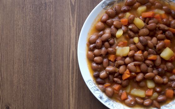 Turkish food: Carrot and potatoes cooked with kidneys meal: Barbunya Pilaki  close- horizontal top view