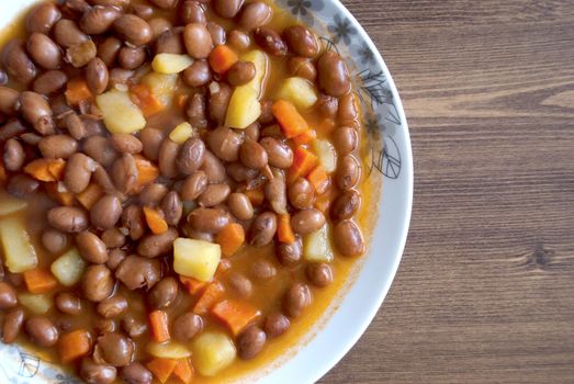 Turkish food: Carrot and potatoes cooked with kidneys meal: Barbunya Pilaki  close- horizontal top view