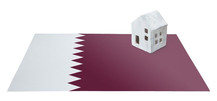 Small house on a flag - Living or migrating to Qatar